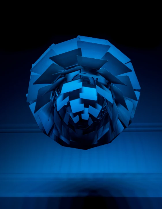blue lights illuminate the image of an intricately constructed circular mirror