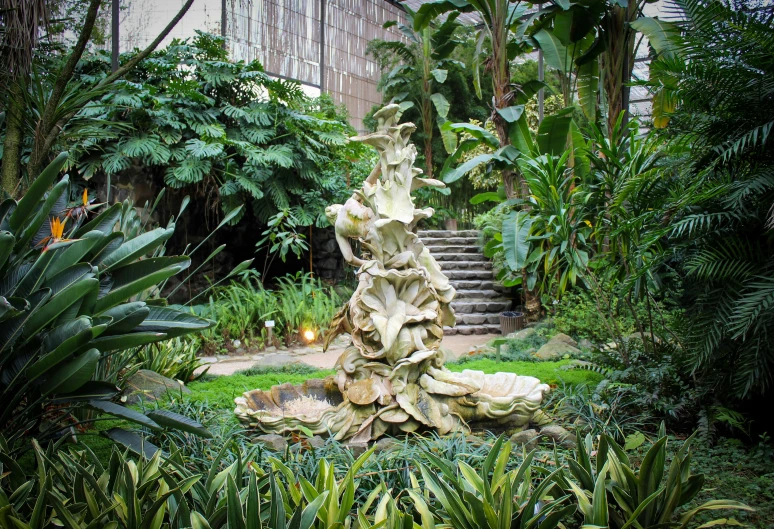 an unusual garden with a stone fountain