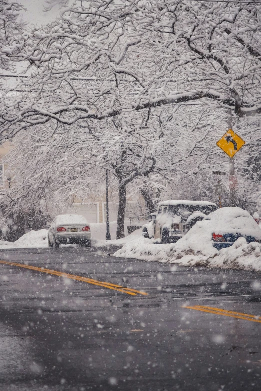 a street filled with lots of snow and lots of traffic