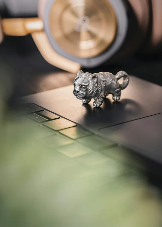 a small model of a cat on a table