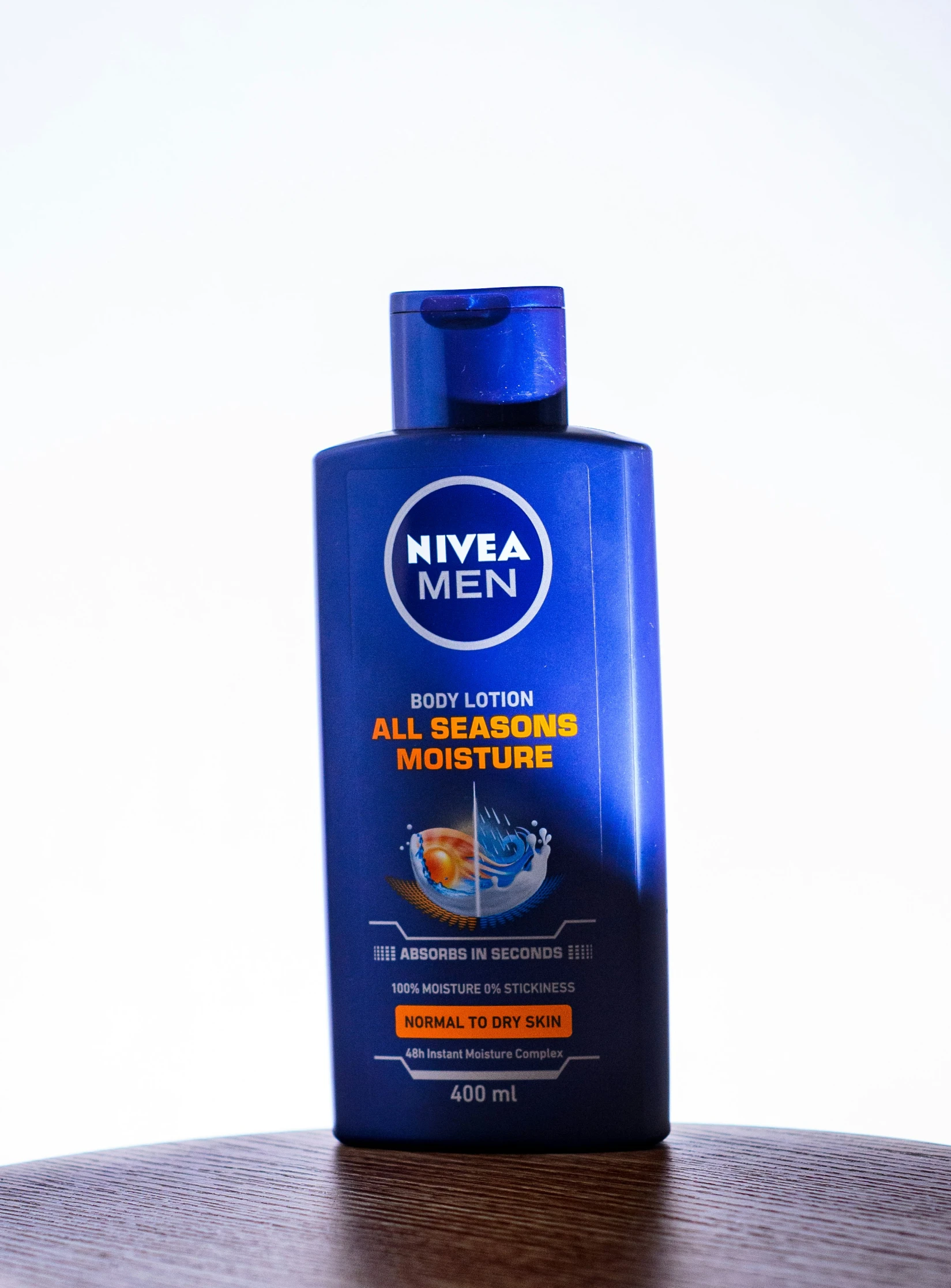 a blue bottle of nivea men all occasion moisture lotion