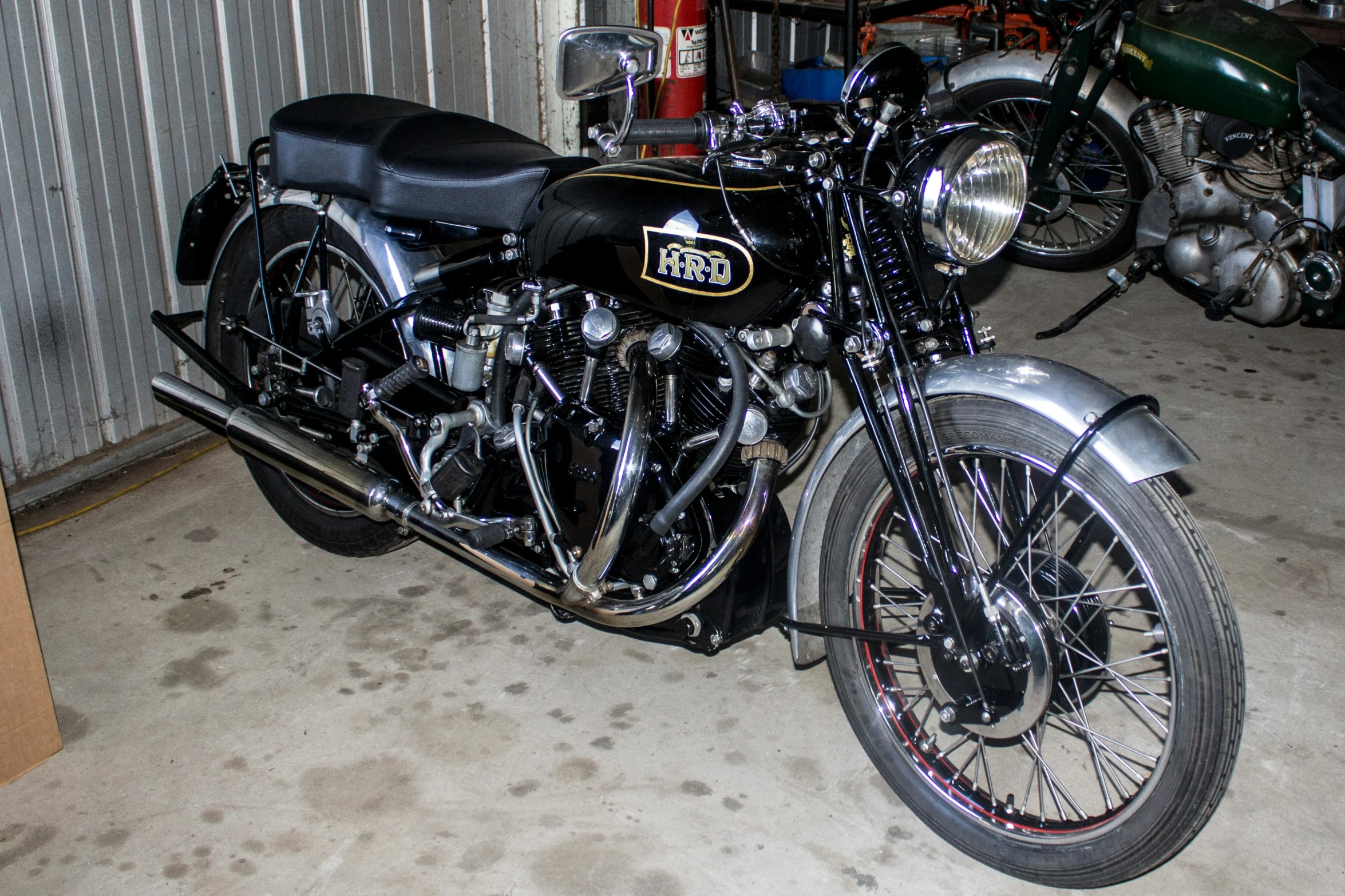 a black motorcycle parked in a garage