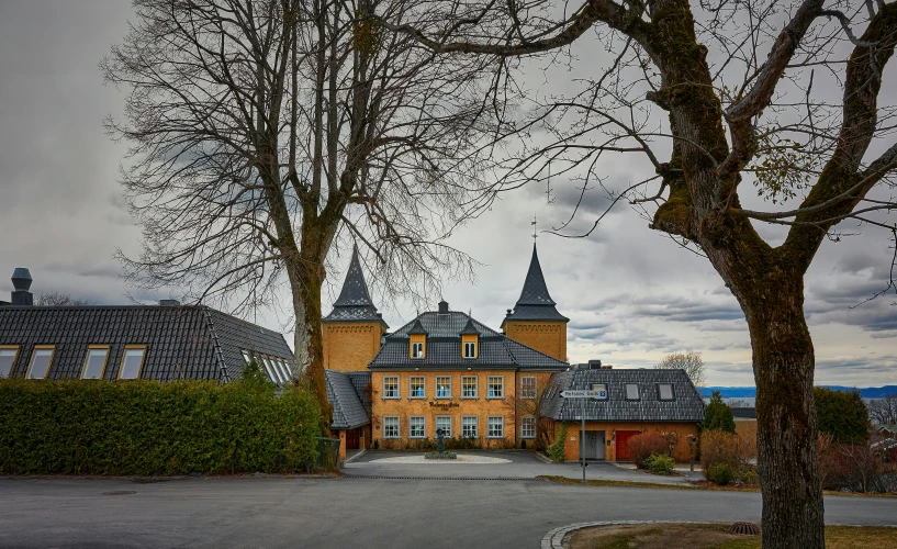 this old house is beautiful, red and brown with grey roof