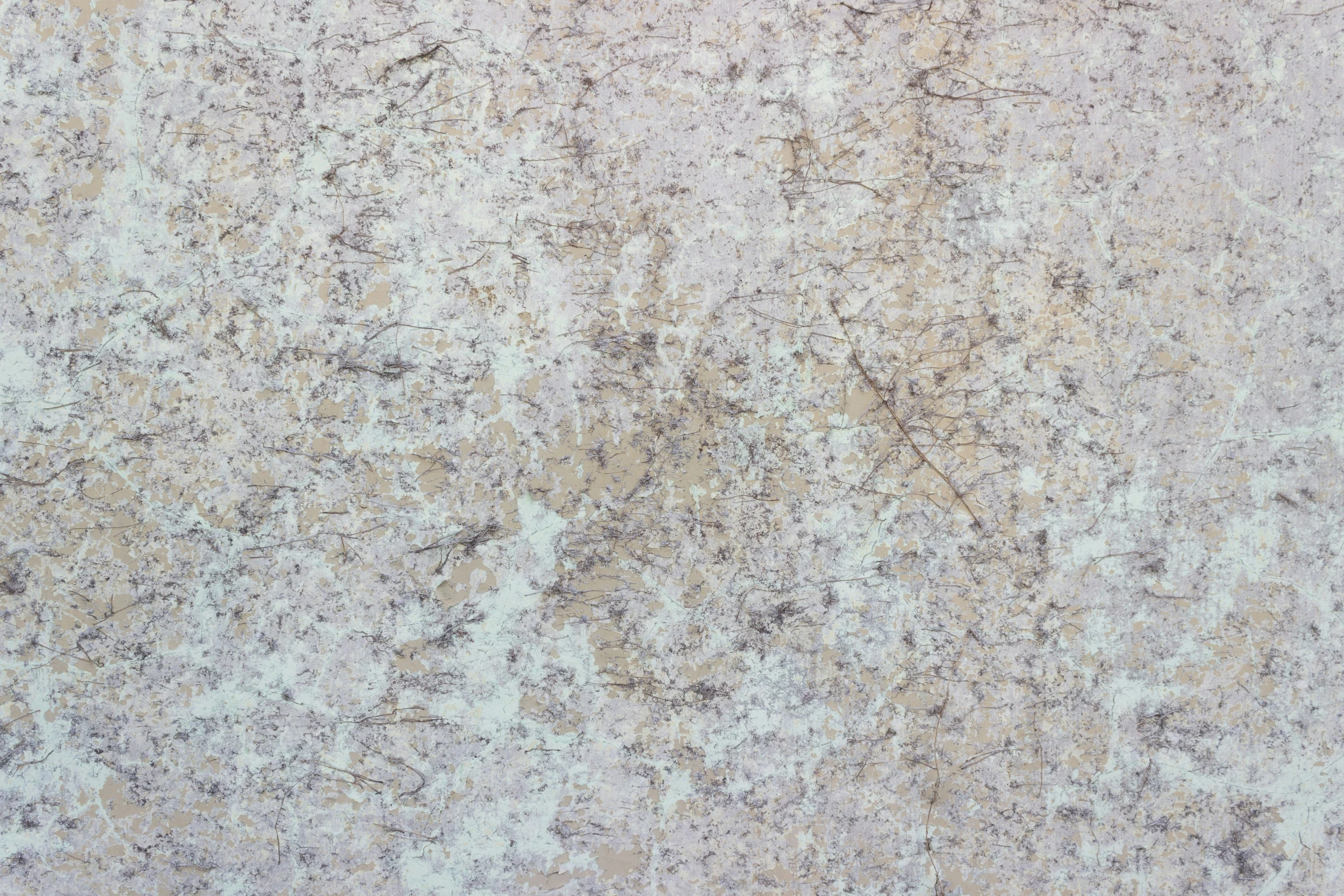 a white counter top with gray and tan textured surfaces