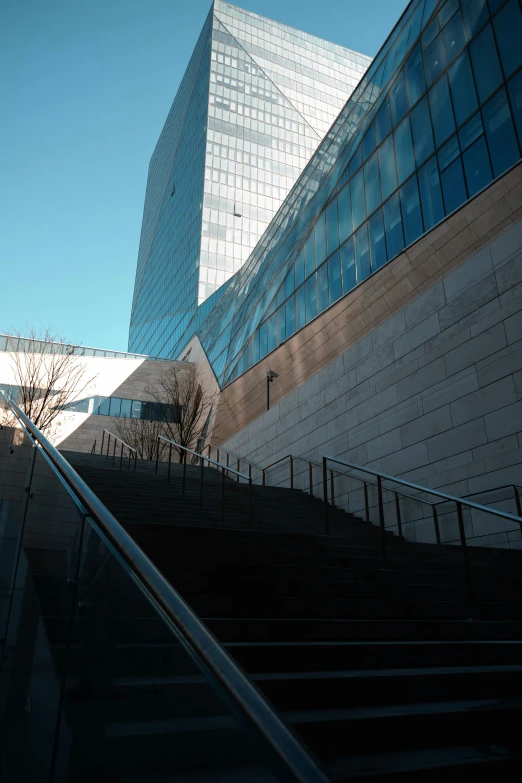 steps leading down to an architectural building with windows