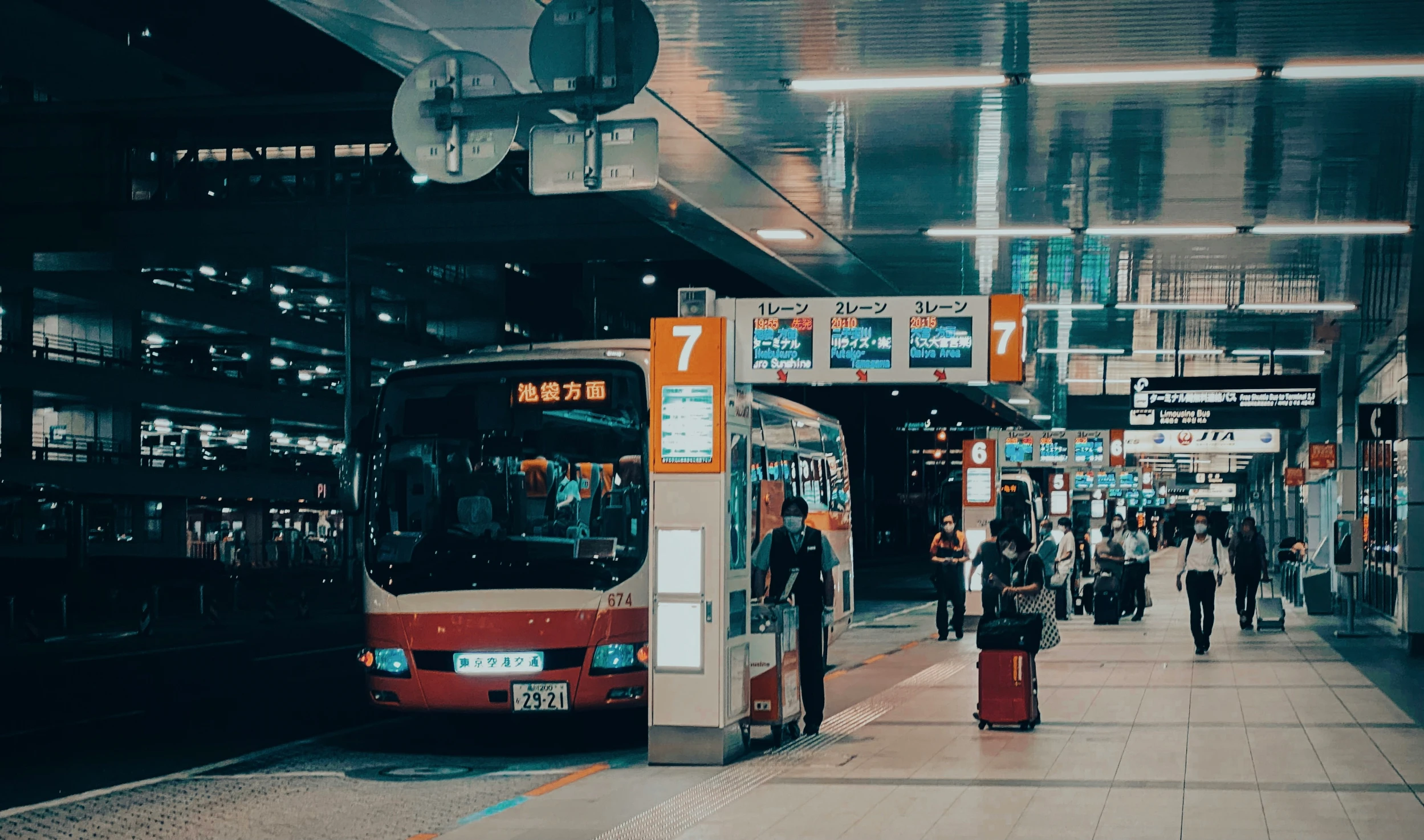 a bus is pulled up to the curb at a transit station