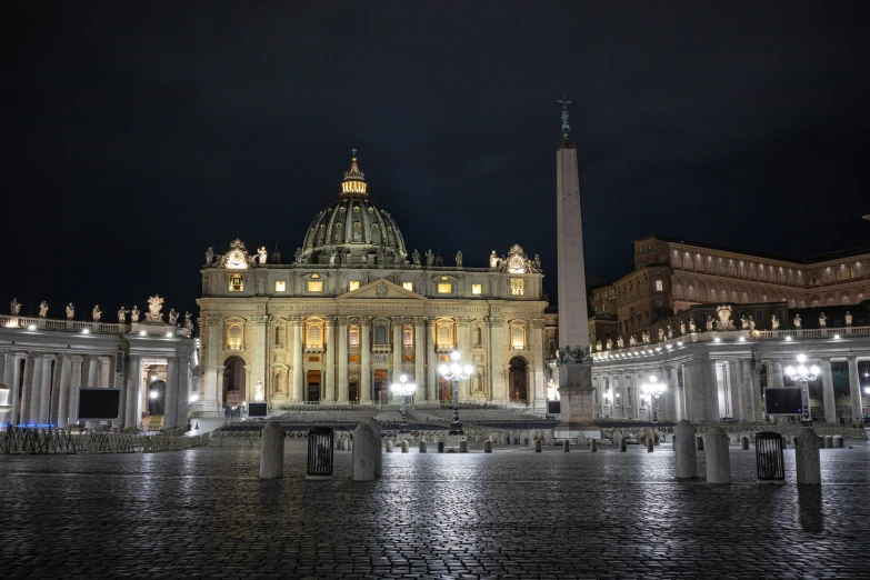 a tall cathedral next to a very tall obelisk