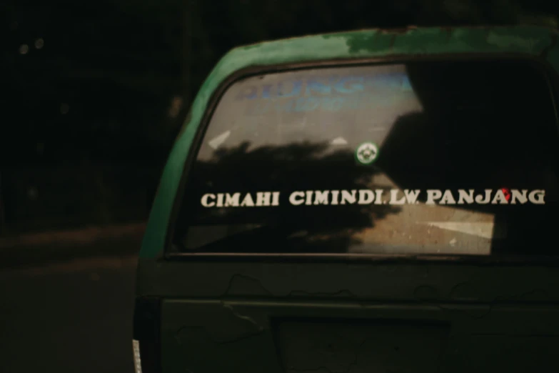 a green and black car with the words china mindi law pandang