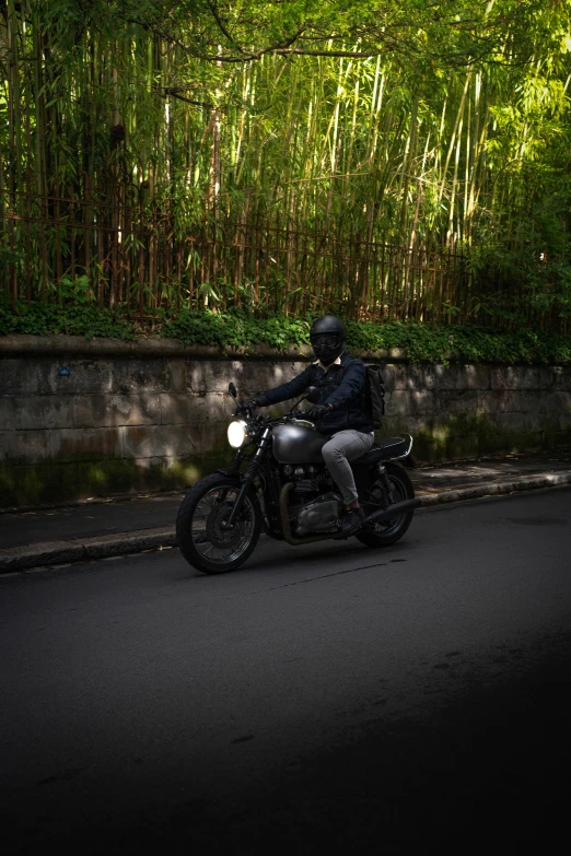 a motorcyclist on a road in the evening time