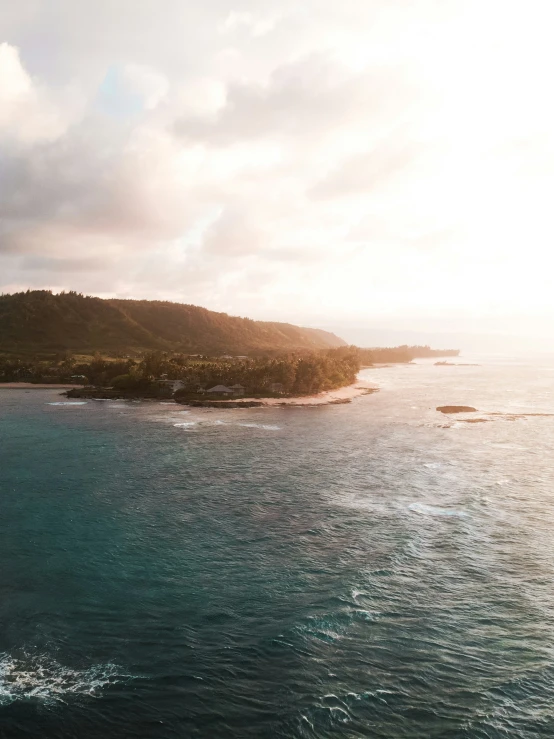 an island sits on the ocean in a body of water