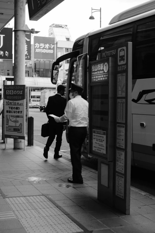 people walk past an automated public transit bus