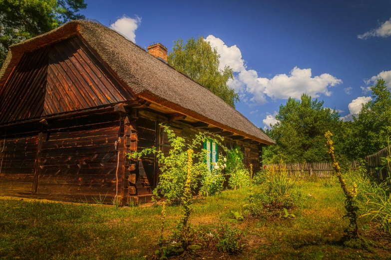 a large brown building sitting next to green trees