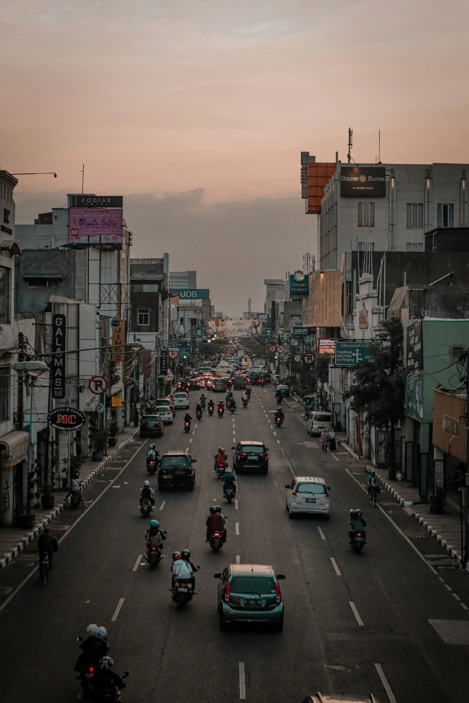 a group of cars are driving on the street