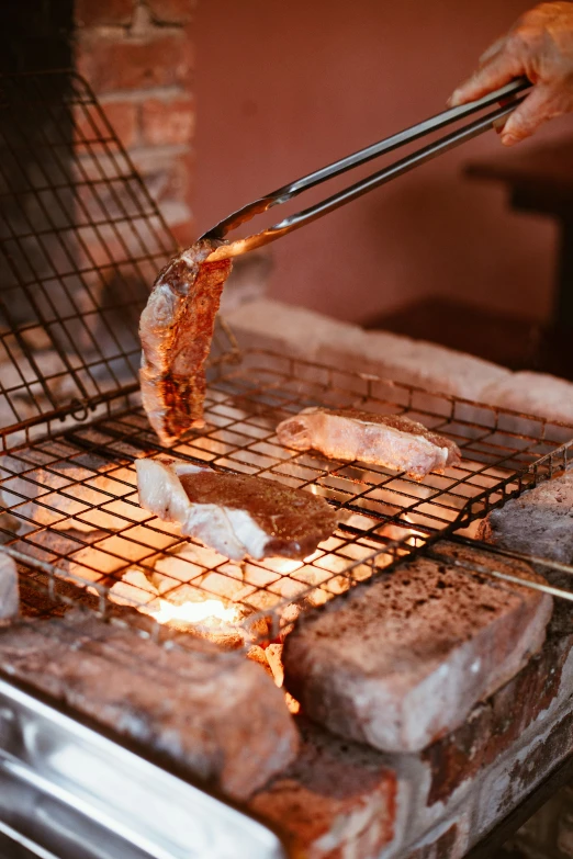 someone is cooking some food on top of a grill