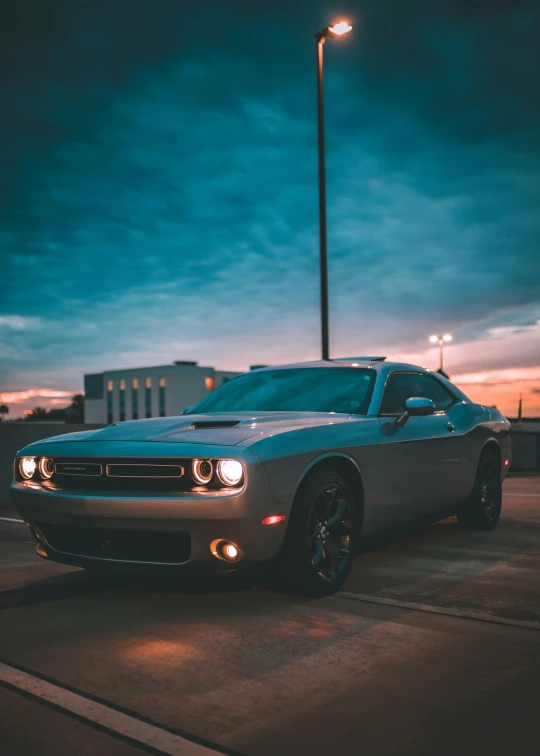 the front view of a dodge car at night