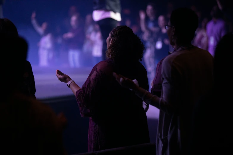 a person standing in front of a group of people