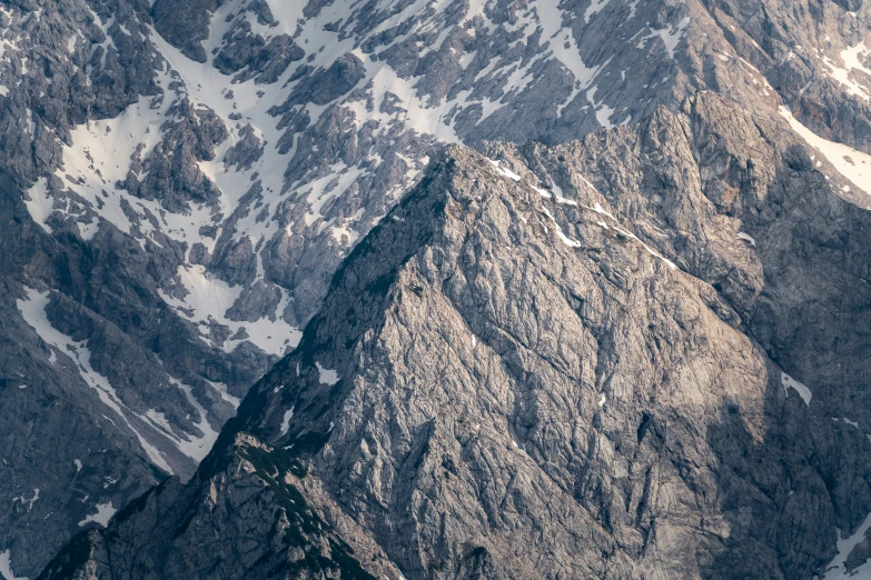 some large, very high mountains with snow on them