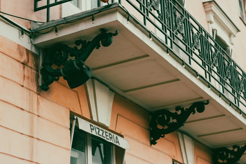 a building with a sign attached to the side