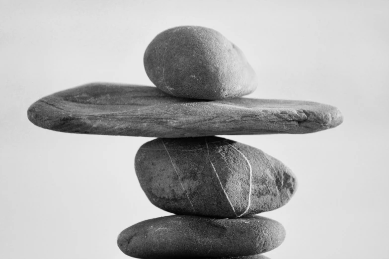 the stacked rocks are stacked high on each other