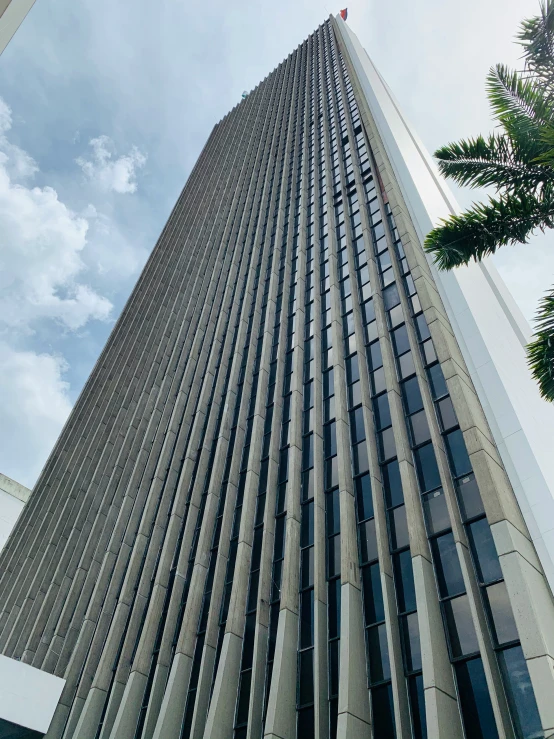 a very tall building on a cloudy day