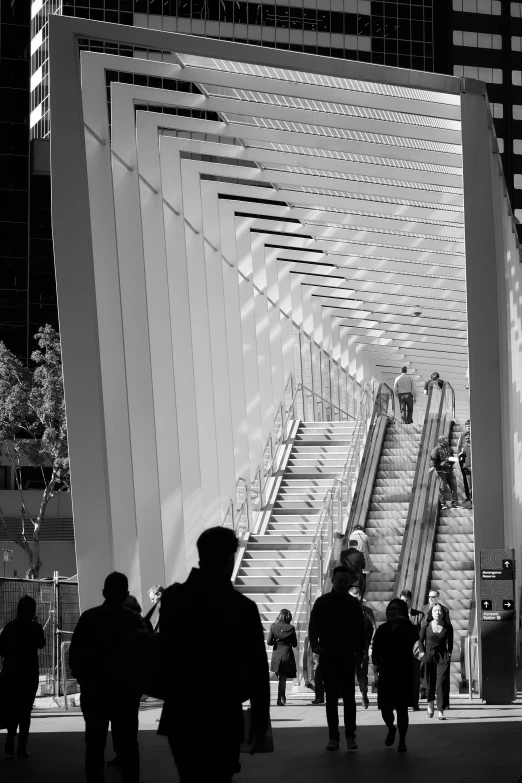 a city scene with people walking down a sidewalk