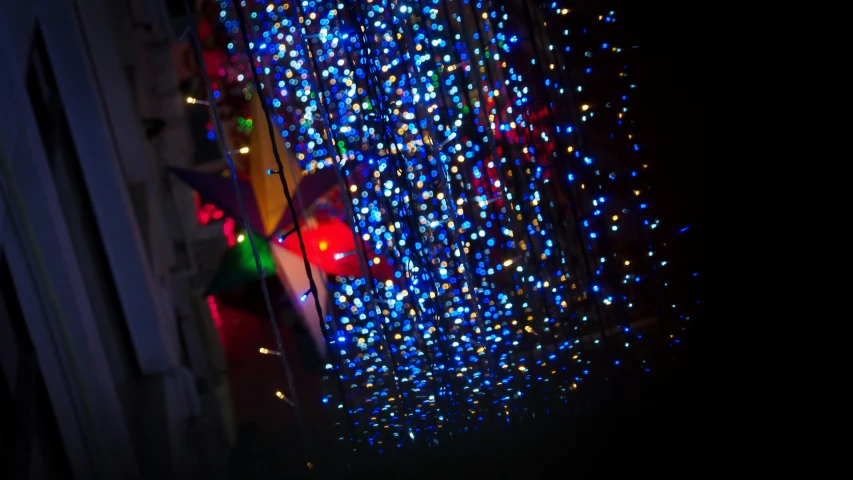 a bunch of lights on a window next to a door