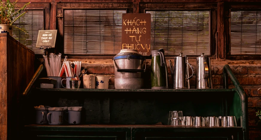 the table contains several cups and pitchers