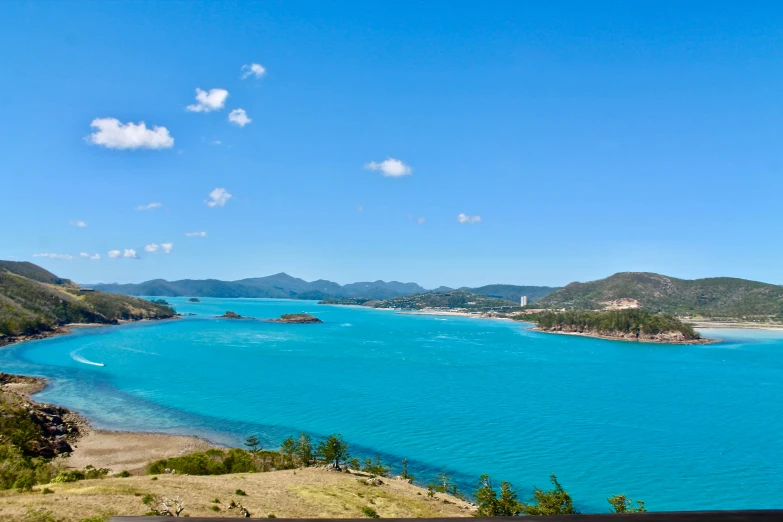 a view of an ocean with water surrounded by mountains