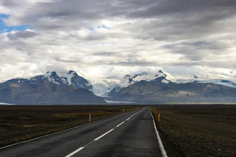 the highway runs into the snowy mountains