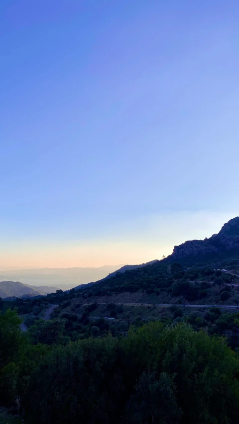 view of a hill from below and a sky line in the background