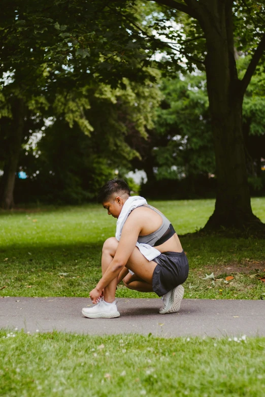 a person sitting on the ground with no shoes