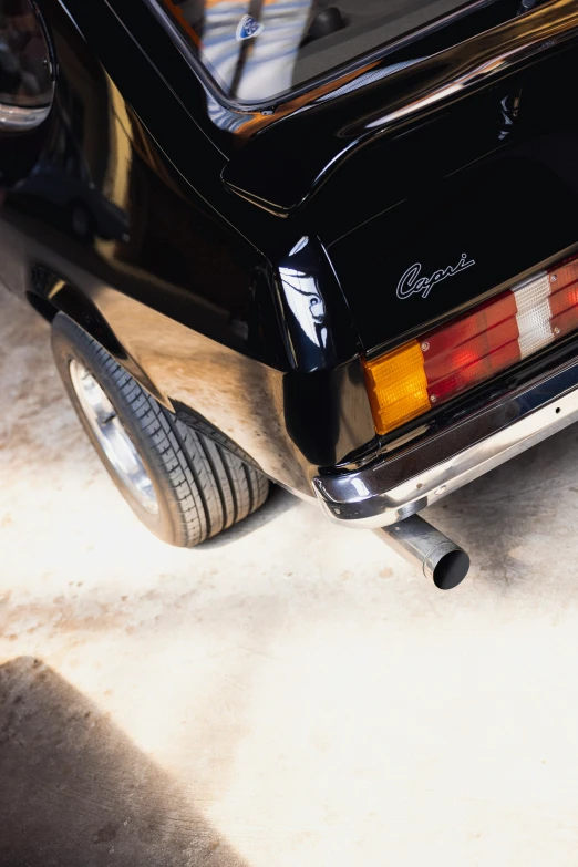 an old car parked inside of a garage