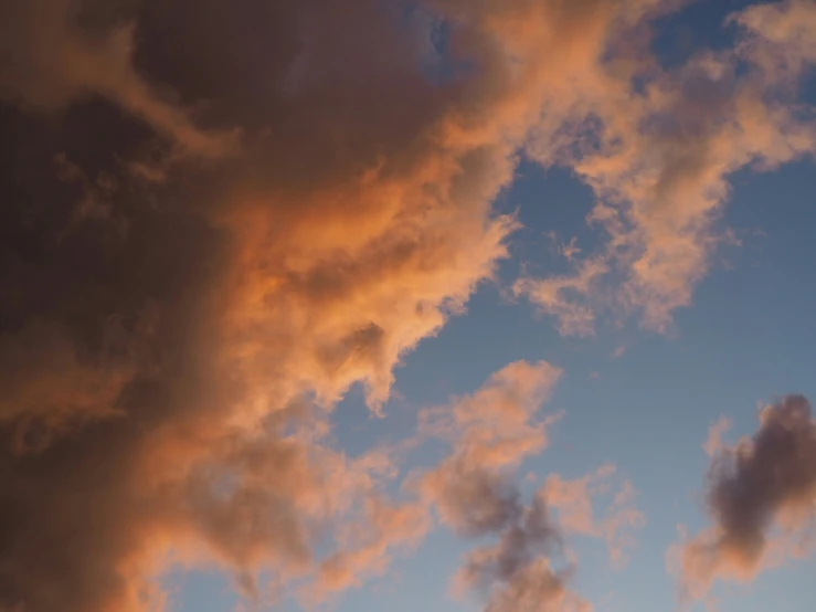 clouds above a clear sky at sunset