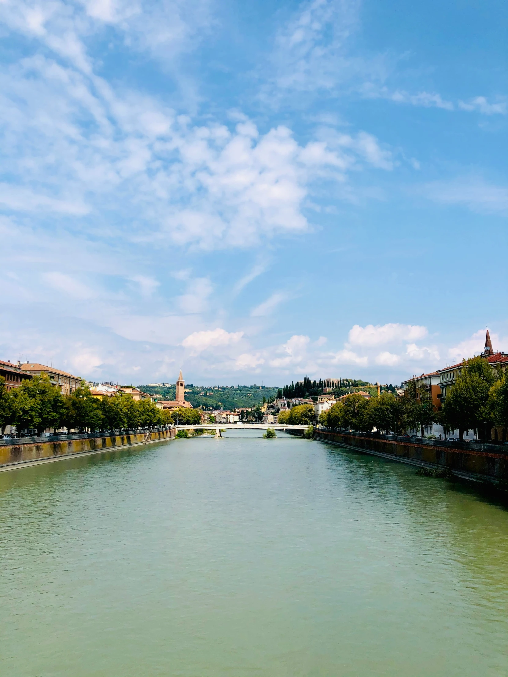 a canal running through the center of an old european town