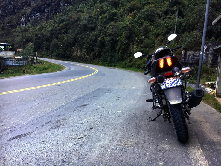 a motorcycle sitting on the side of the road