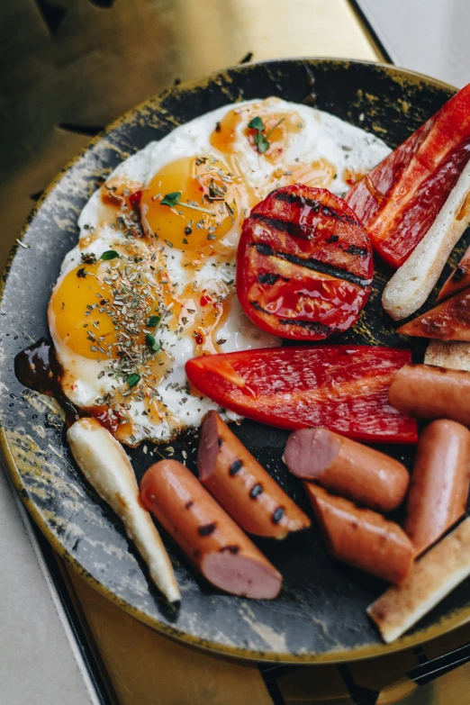 this is an english muffins, sausage and egg breakfast