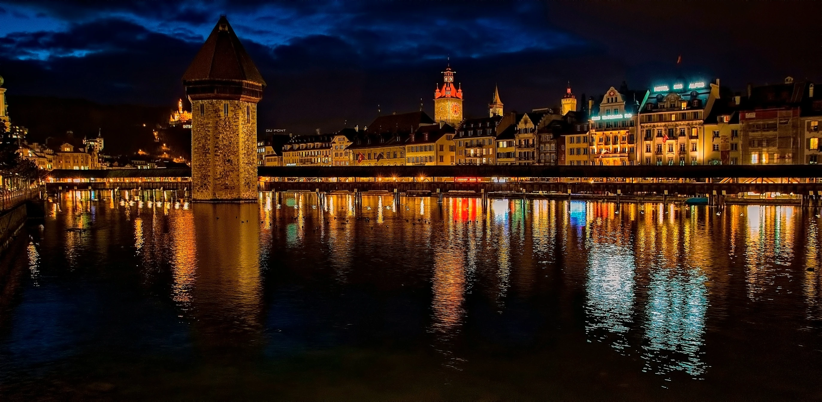 city buildings are illuminated by the moonlight sky