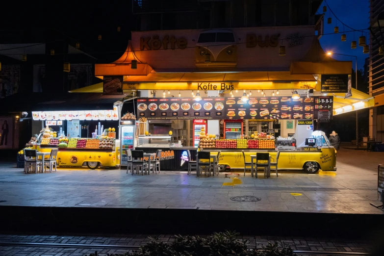 a fast food stand lit up at night