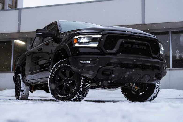 a truck is parked outside in the snow