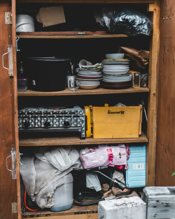 several shelves holding different types of items in storage