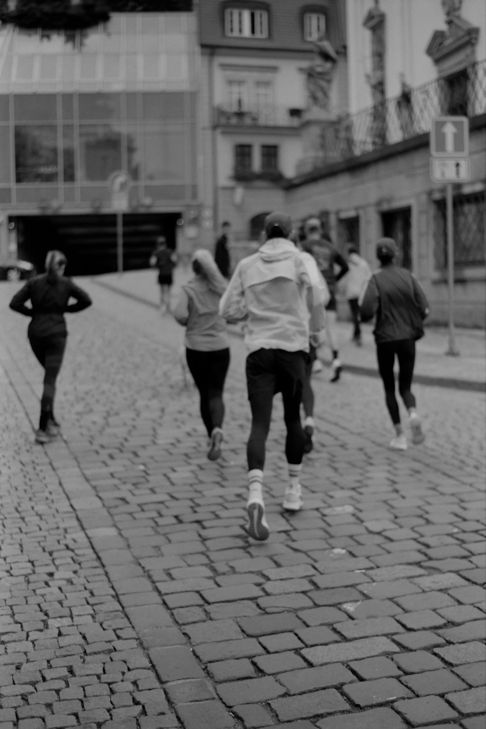 a group of people are running down the street