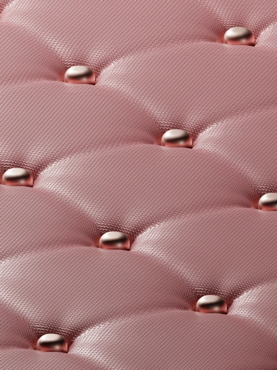 large pink upholstered fabric covering a bed