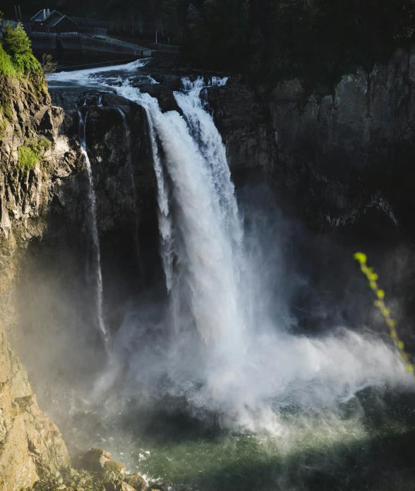 a large waterfall in the middle of a river