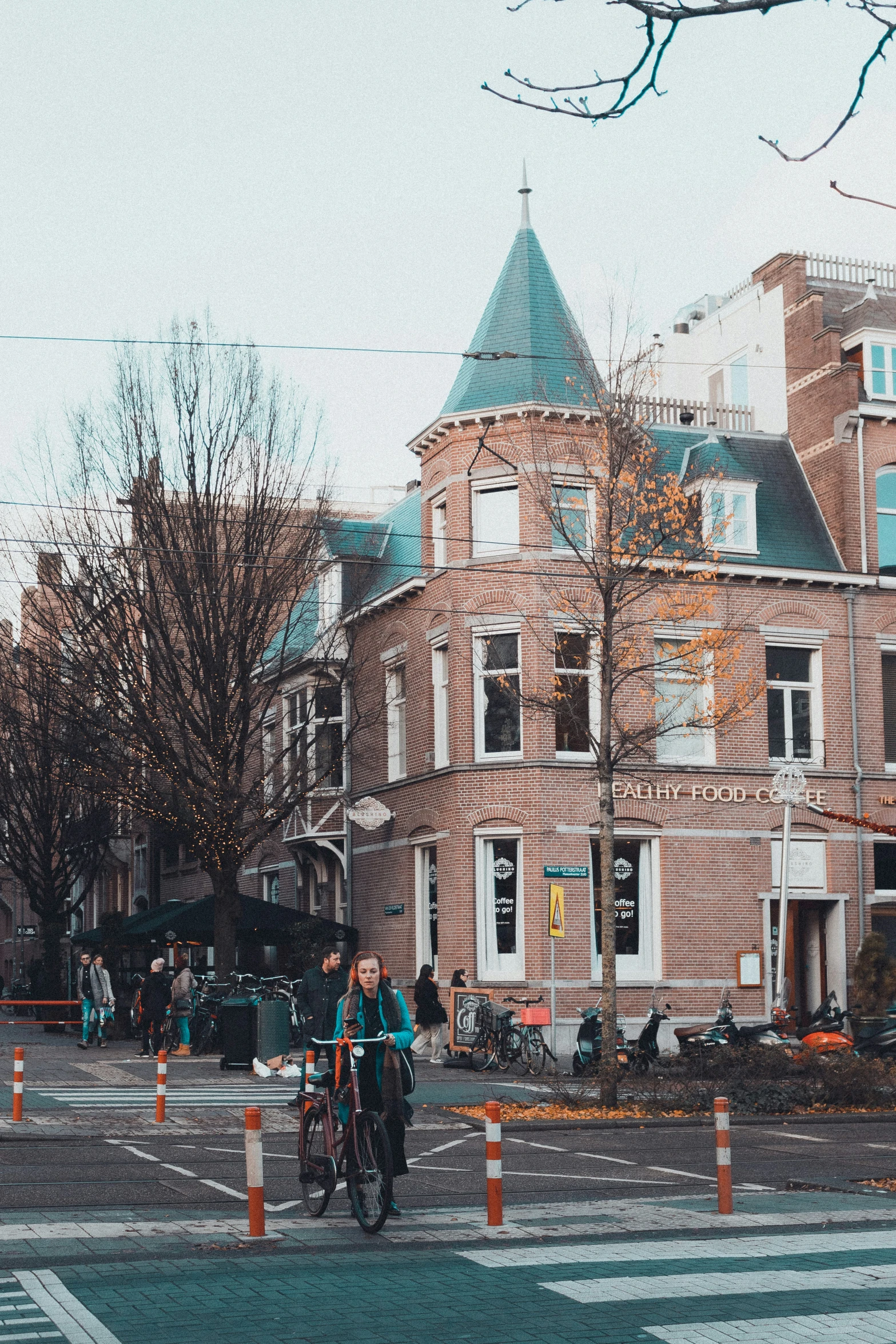 people crossing a street at an intersection in the city