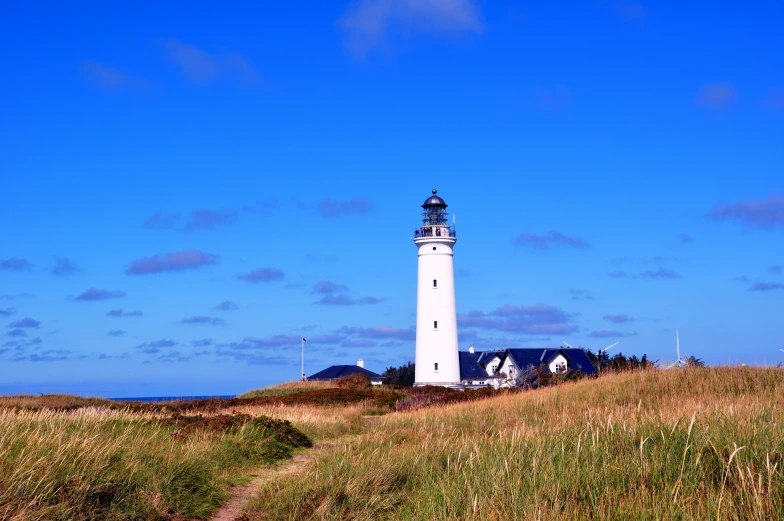 the white lighthouse has a dark black top