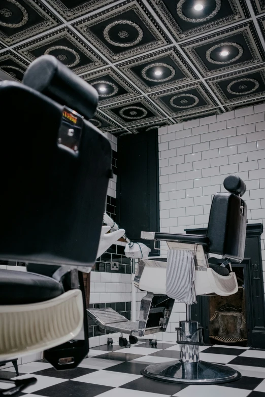 a vintage salon room with barber chairs and tiled floor