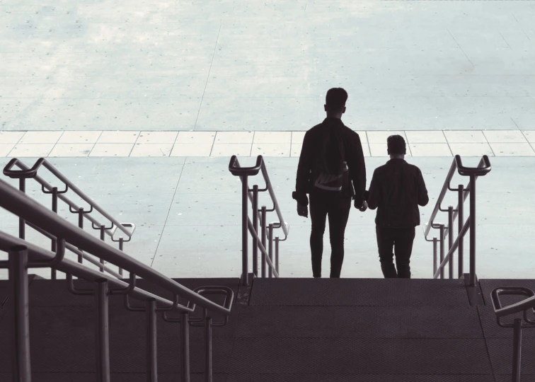 man and woman standing at the top of a stairs