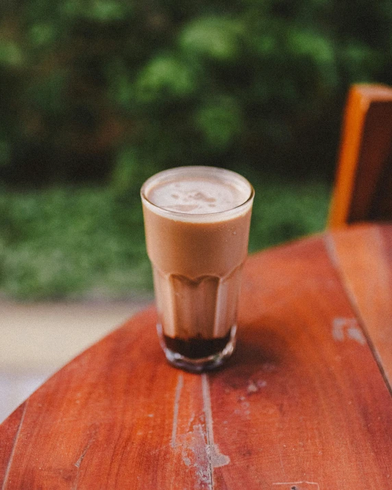 a drink on top of a wooden table