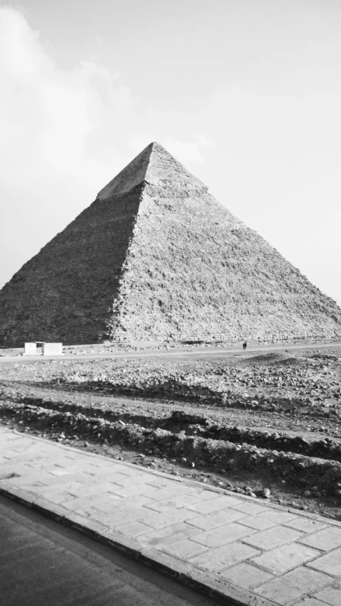 a large tall pyramid sitting next to a road