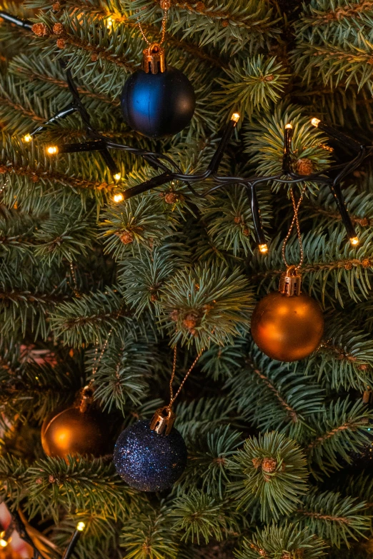 a large christmas tree has ornaments on it